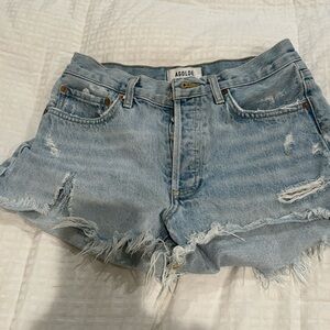 AGOLDE "Parker" distressed cut-off denim shorts.
